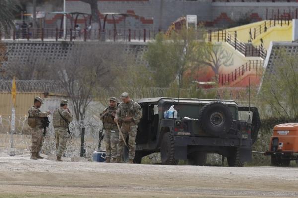Texas Natio<em></em>nal Guardsmen stand behind a gate at Shelby Park in Eagle Pass, Texas, USA, 13 January 2024.
