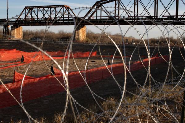 Co<em></em>ncertina wire, placed by the Texas Natio<em></em>nal Guard, is set up around the perimeter of a pit previously used to hold migrants in Shelby Park, at the U.S.-Mexico border in Eagle Pass, Texas, U.S., January 16, 2024. 