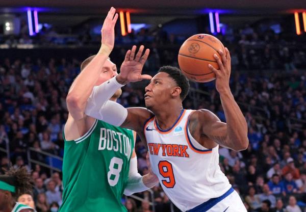 RJ Barrett, who scored 24 points, drives on Kristaps Porzingis during the Knicks' loss.