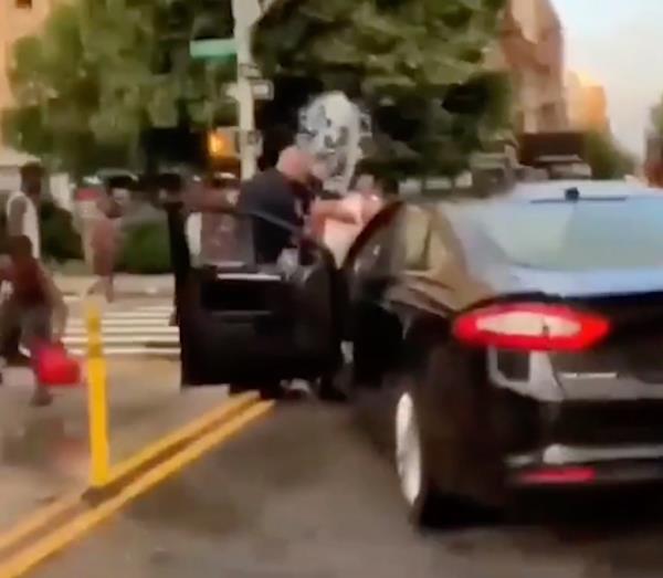 Screen grabs show uniformed NYPD cops getting drenched with buckets of water by brazen young men in Harlem and Brooklyn in 2019.