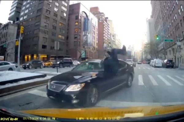 A photo screengrab of a Jan. 17 incident in which a Brooklyn woman was charged with mowing down a police officer at a Manhattan crime scene with her vehicle in a shocking moment caught on video. 