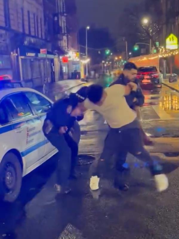 Screen grabs from video show a man fighting with officers before briefly escaping and being caught again at Ludlow and Stanton Street. 