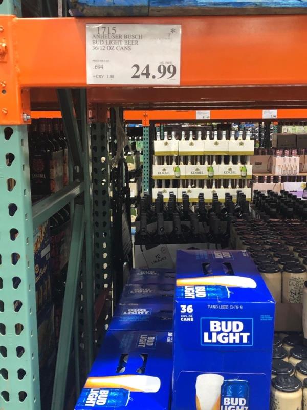 Social media users shopping at Costco posted images showing a black star on the price display above shelves stacked with cases of Bud Light.