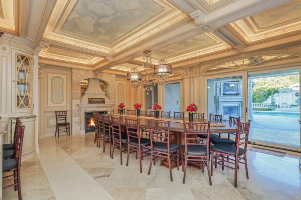 Coffered ceilings, ornate moldings and multiple fireplaces extend throughout the mansion.