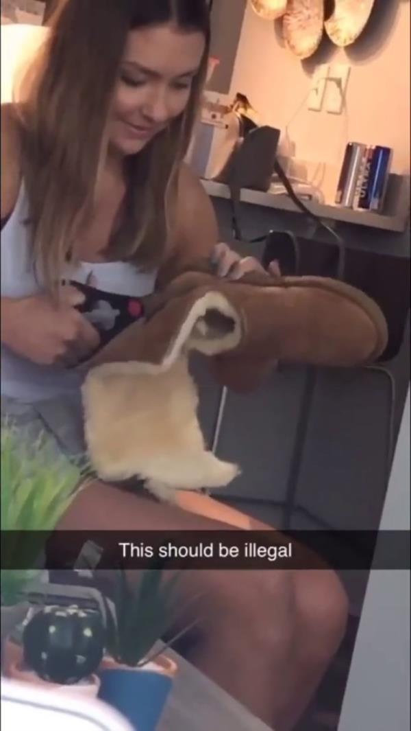 Girl cutting up her Ugg boots