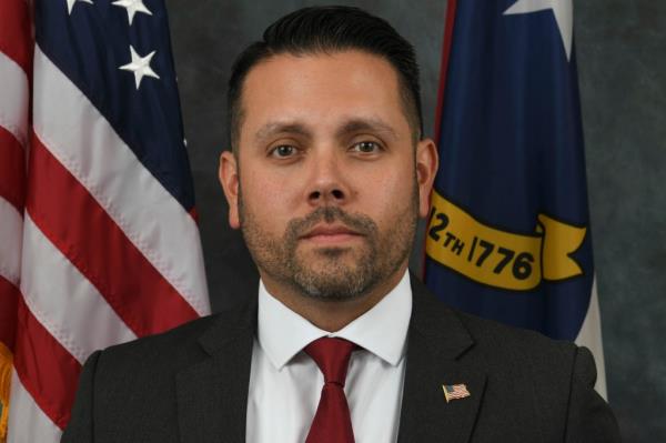 North Carolina Department of Corrections officer Sam Polche was shot in the gunfire.