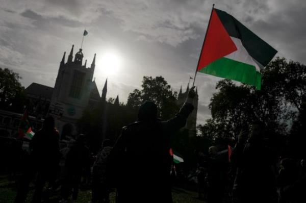 Mandatory Credit: Photo by Alberto Pezzali/NurPhoto/Shutterstock (14171708ai) Demo<em></em>nstrators hold placards and flag as they march through central Lo<em></em>ndon in support of Palestine, on October 28, 2023, demanding an end to the siege of the Gaza Strip, which Israel imposed three weeks ago after Hamas, the Palestinian militant group that governs Gaza, launched a deadly attack on communities in southern Israel. Pro Palestinian Demo<em></em>nstration In London, United Kingdom - 28 Oct 2023