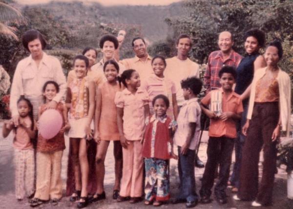 Kamala Harris, holding a pink balloon, and her family in Jamaica.
