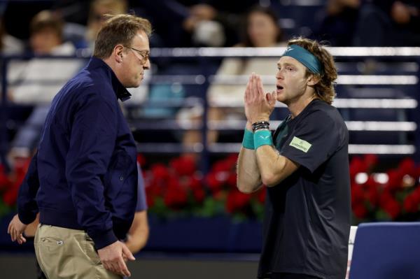 Andrey Rublev is dismissed by the court supervisor after shouting at a line judge while playing Alexander Bublik of Kazakhstan in their semifinal match during the Dubai Duty Free Tennis Champio<em></em>nships at Dubai Duty Free Tennis Stadium on March 01, 2024 in Dubai, United Arab Emirates.