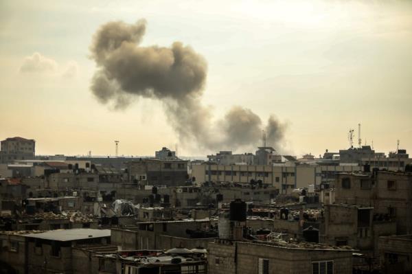 Smoke rises over southern Gaza on Thursday following Israeli bombardments.