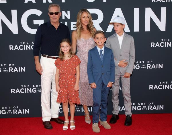 Kevin Costner and Christine Baumgartner attend the premiere of 