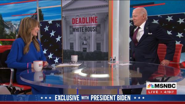 Joe Biden walks off set at the end of his interview on MSNBC
