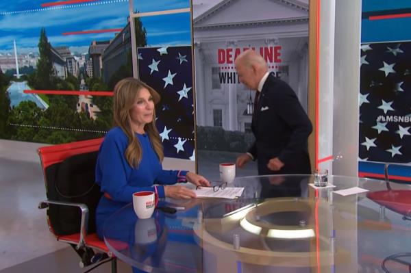 Joe Biden walks off set at the end of his interview on MSNBC