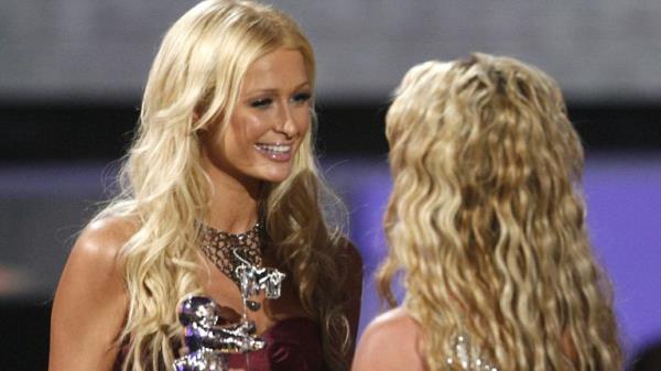 Paris Hilton (L) presents the Best Pop Video award to Britney Spears for 