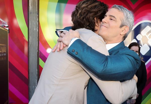 Television host Andy Cohen is embraced by singer John Mayer after unveiling of his star on the Hollywood Walk of Fame in Los Angeles, California, U.S., February 4, 2022.