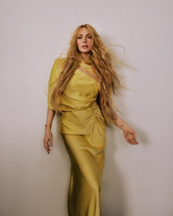Dress, $3,100 at Stella McCartney; Chatelaine ring in 18-k yellow gold with yellow beryl and diamonds, price upon request at David Yurman; Wedding rings and bracelets, Lohan’s own