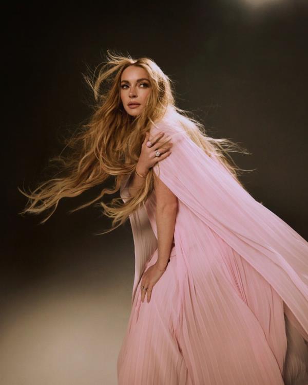 Pink chiffon cape dress, $805 at Self-Portrait.com; Diamant Evanescent ring (Lohan’s right ring finger) in 18-k white gold with diamonds, both price upon request at</p>

<p>　　Chanel.com; Albion ring (Lohan’s right index finger) in sterling silver with pink opal and diamonds, $2,700 at DavidYurman</p>

<p>　　.com; Wedding rings and bracelets, Lohan’s own</p>

<p>　　