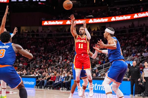 Atlanta Hawks guard Trae Young (11) shoots against the New York Knicks during the second half at State Farm Arena.