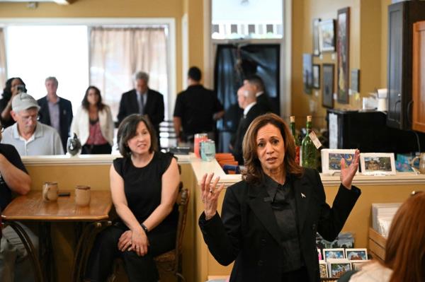 US Vice President and Democratic presidential candidate Kamala Harris speaks with patrons at a cafe and bookstore in Johnstown, Pennsylvania, September 13, 2024.
