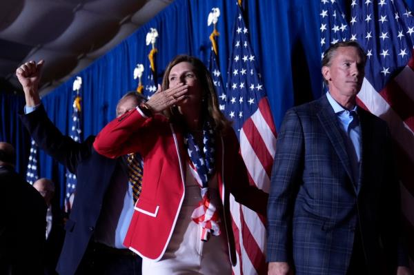 South Carolina Lt. Gov. Pamela Evette and her husband David walking from the stage after Do<em></em>nald Trump spoke at the primary election party.