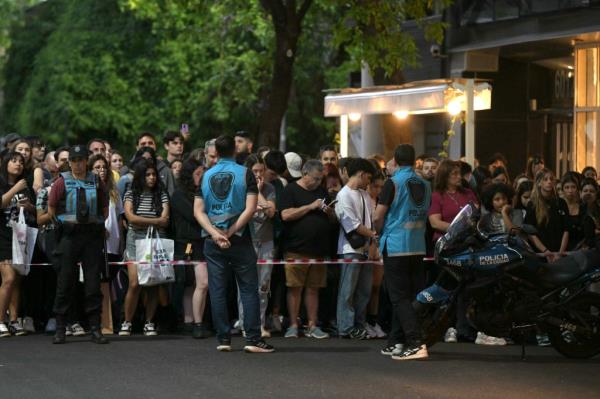 Fans wait near the hotel wher<em></em>e Liam Payne died