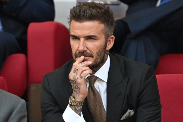Former England player David Beckham attends the Qatar 2022 World Cup Group B football match between England and Iran at the Khalifa Internatio<em></em>nal Stadium in Doha on November 21, 2022. (Photo by Paul ELLIS / AFP) (Photo by PAUL ELLIS/AFP via Getty Images)