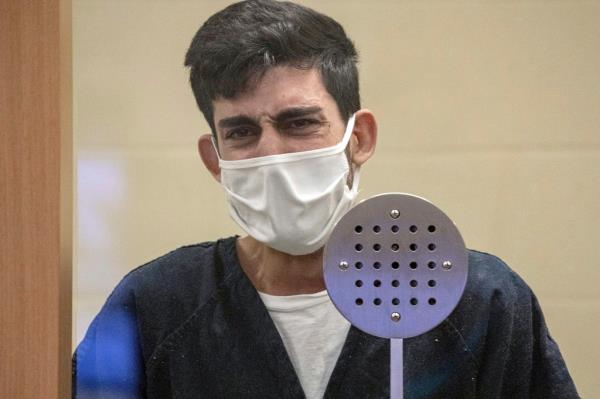 Ali Abulaban, 29, reacts during his arraignment.