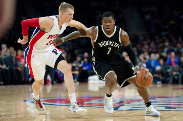 Nets guard Joe Johnson (7) drives to the basket against Detroit Pistons forward Kyle Singler (25) during a 2014 game.