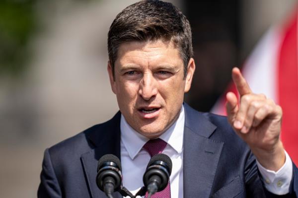 Rep. Bryan Steil, in a suit and tie, addressing the audience at a 2024 campaign rally in Kenosha, Wisconsin.