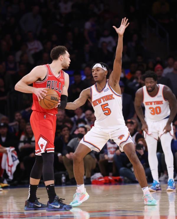 Zach LaVine #8 of the Chicago Bulls looks for an opening as Immanuel Quickley #5 of the New York Knicks defends