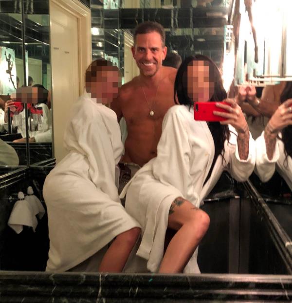 Hunter Biden and two women in robes.