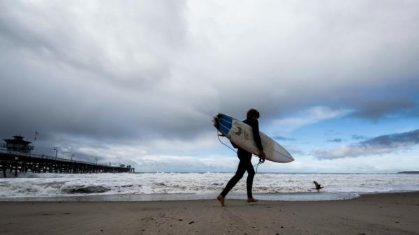  surfer heads to the water