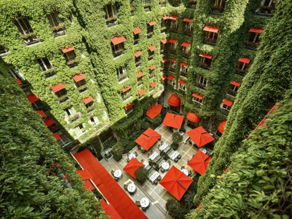 Luxurious Hotel Plaza Athenee in Paris with a stunning courtyard serving as a restaurant