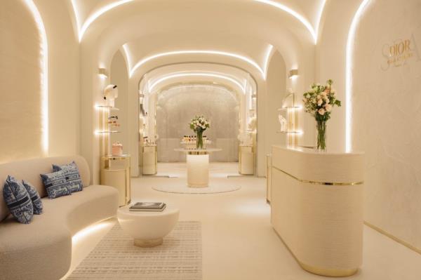 Interior view of Hotel Plaza Athenee, Paris, highlighting the Dior Institute spa, featuring a couch and flowers
