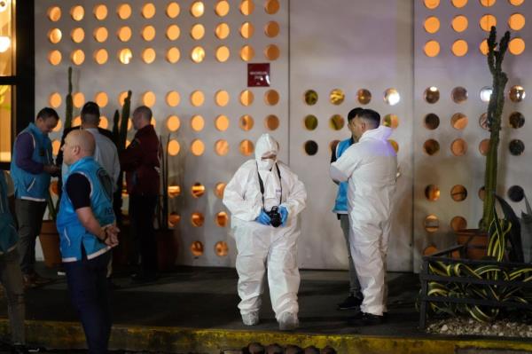 Forensic investigators exit the hotel wher<em></em>e former One Direction singer Liam Payne, was found dead after falling from a balcony in Buenos Aires, Argentina, Wednesday, Oct. 16, 2024. 