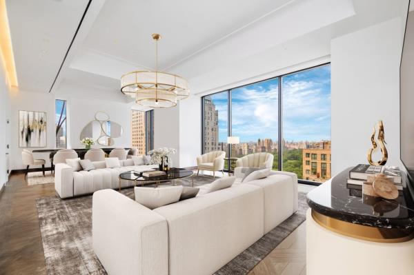 Another view inside the unit, which has Central Park front and center through massive exposures.