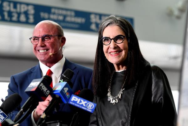 Survivors Dave Sanderson (blue suti/red tie) and Denise Lockie (black hair/black glasses)