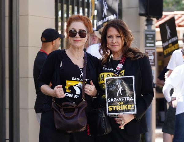 Lisa Ann Walter and Joely Fisher are seen on the SAG-AFTRA picket line