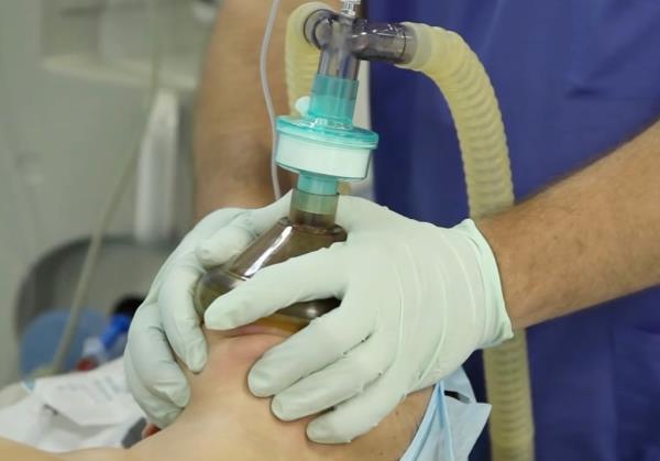A person wearing a mask under surgery. 