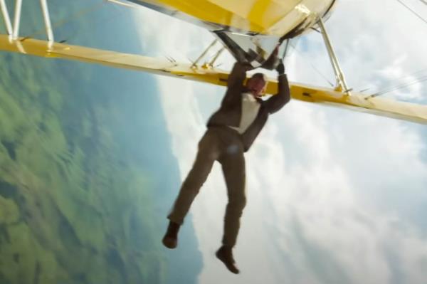 Tom Cruise hanging upside down during a plane sequence in the trailer for Mission: Impossible - The Final Reckoning