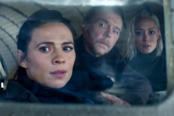 Tom Cruise along with celebrities Hayley Atwell, Simon Pegg, Pom Klementieff looking out a window for the trailer release of Mission: Impossible – The Final Reckoning