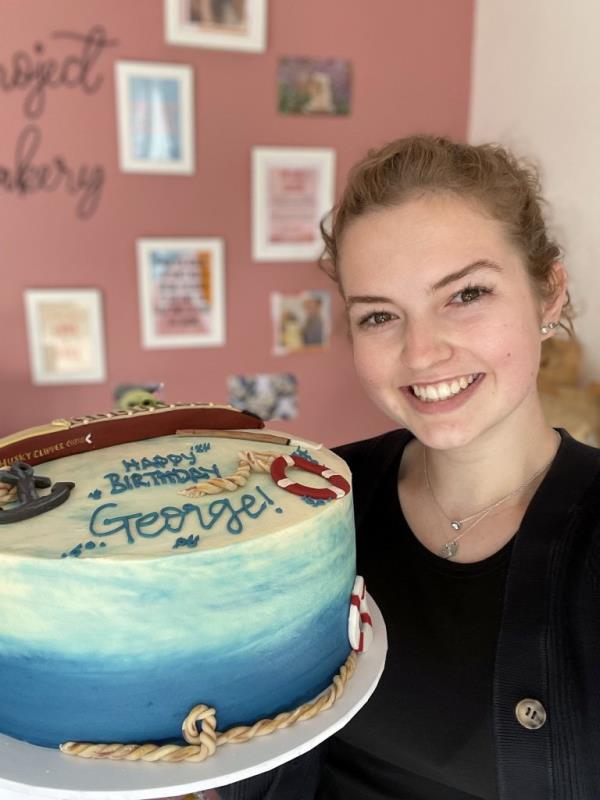 Holly Tait, 22, of Cirencester, England, had no idea what she was getting into when she accepted the gig to bake a birthday cake for a man named 