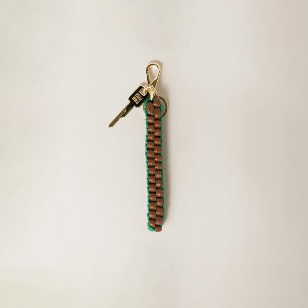 Miu MIu's lanyard accessory in leather. 