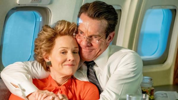 Dennis Quaid as Ro<em></em>nald Reagan hugs Penelope Ann Miller playing Nancy Reagan.