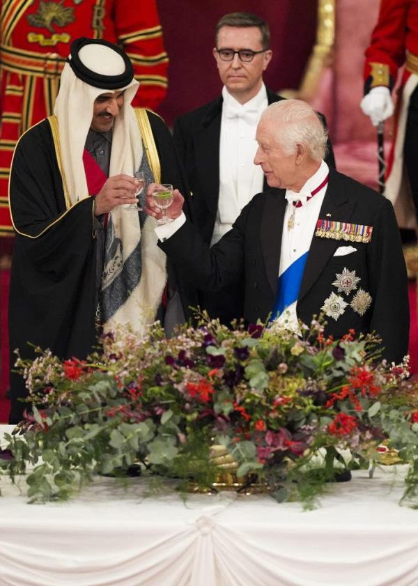 King Charles III toasting with a glass of wine at a State Banquet with Qatar's Emir Sheikh Tamim bin Hamad al-Thani at Buckingham Palace, Lo<em></em>ndon in 2024