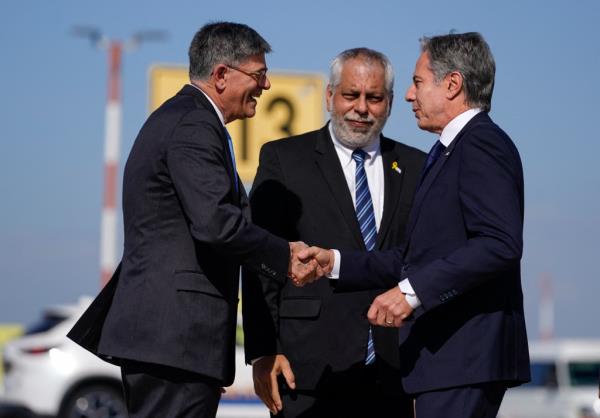 Bl<em></em>inken (R) is greeted by US Ambassador to Israel Jack Lew (L) and Israeli Ministry of Foreign Affairs Deputy Director General for North America Lior Hayat upon arrival at the Ben Gurion Airport in Tel Aviv