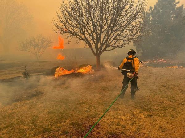 A firefighter battles the Smokehouse Creek Fire, near Amarillo, in the Texas Panhandle. 