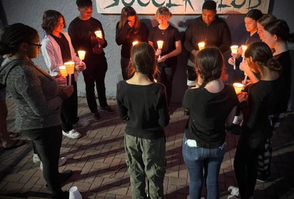 Students of Florida teacher Jamie Felix gather to mourn her death.