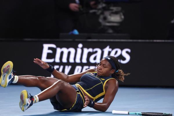 Coco Gauff falls to the ground during a point on Jan. 25, 2024.