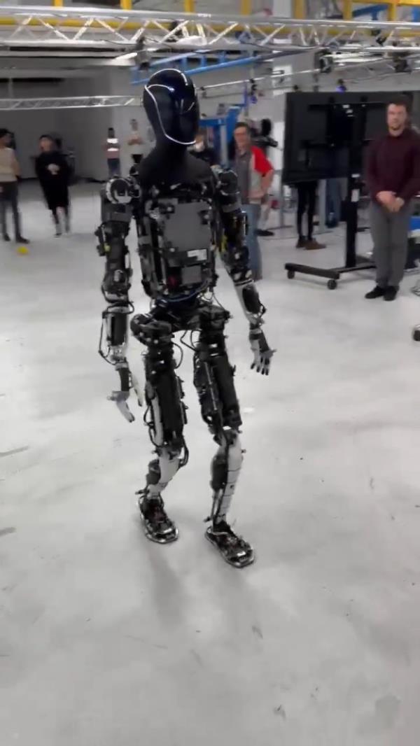 It has a more human-like appearance and movement due to its new hands, feet, neck, and body.